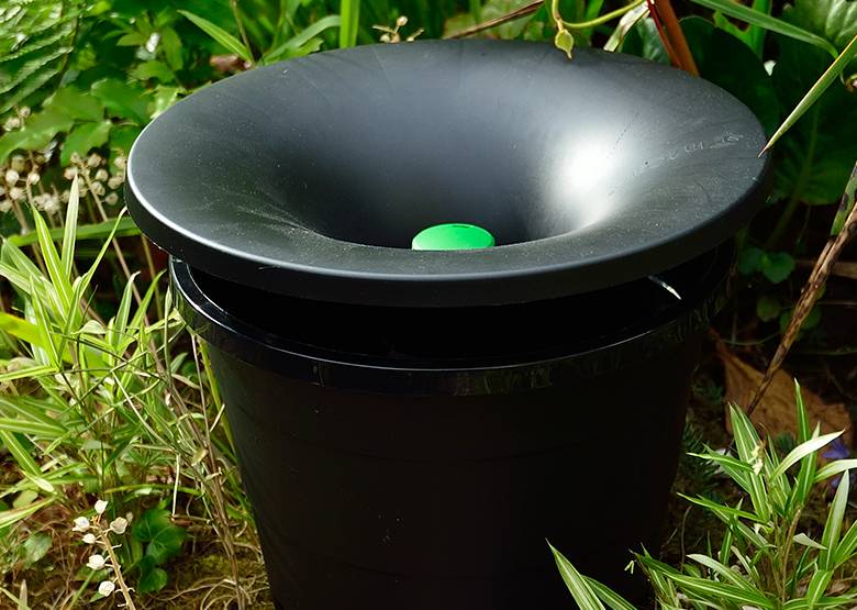 Mosquito trap inside a flower pot.