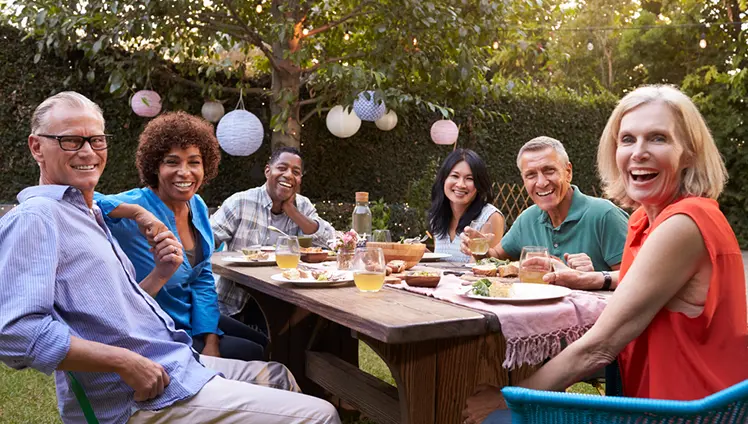 Friends socializing int the backyard.