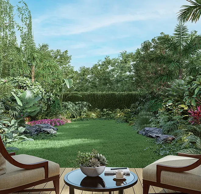 A picture of two lawn chairs overlooking a well-manicured lawn.