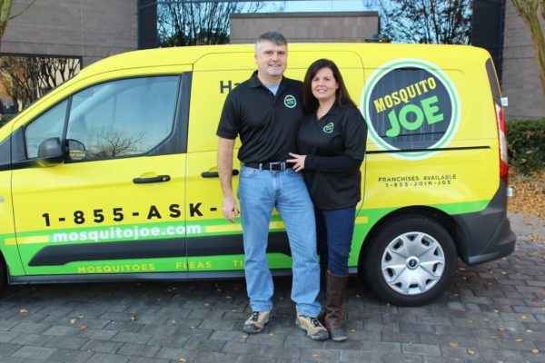 Owners of Mosquito Joe of West Knoxville in front of Mosquito Joe transit van.