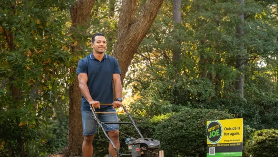 Mosquito Joe van parked in front of house.