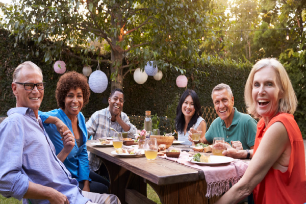 A group of people sitting around a table.