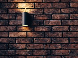  A brick wall illuminated by a soft light.