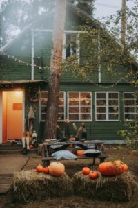 Green house with Halloween decorations.