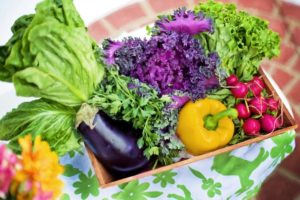 Grocery bag full of vegetables.