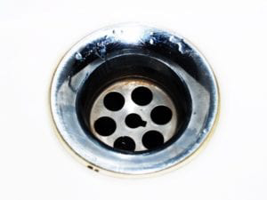 A close-up view of a sink drain.