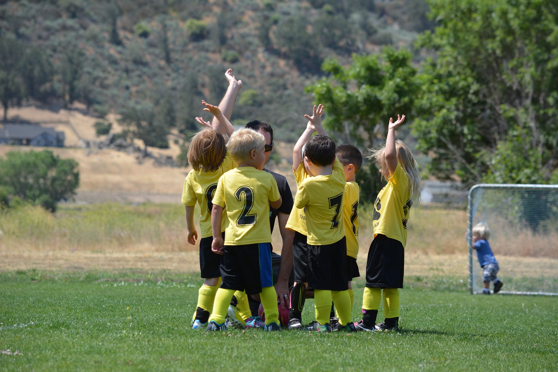 Youth soccer team having a great time outside after winning.