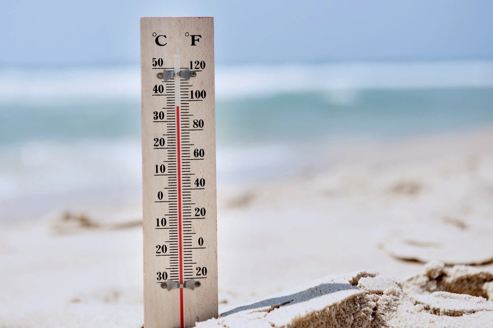 thermometer on the beach sand